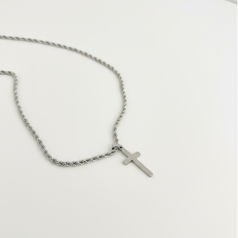 Silver Cross Necklace on White Background