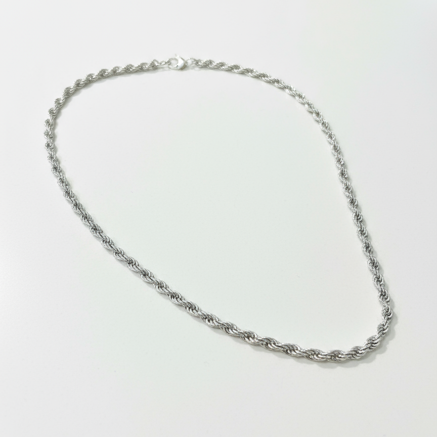 Silver Rope Chain Necklace on White Counter